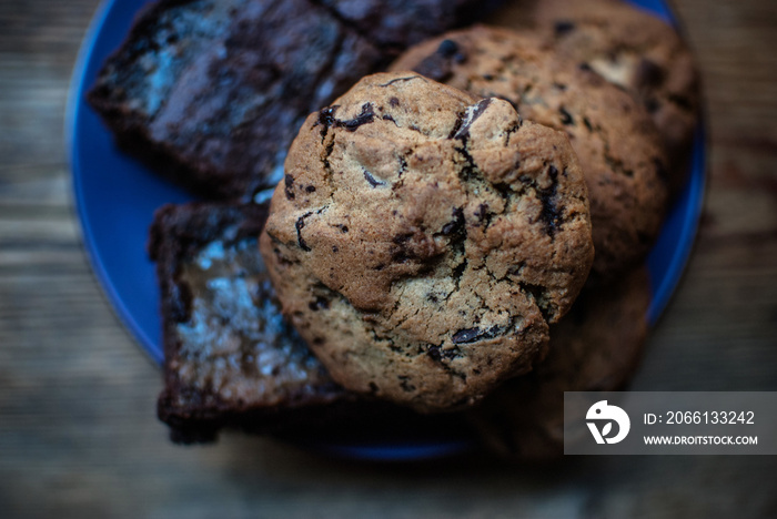 Top view shot of yummy brownies and cookies with chocolate