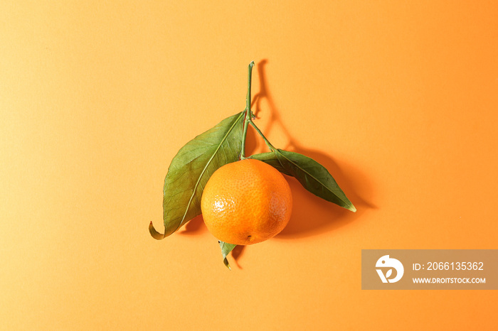 Tasty juicy tangerine on color background