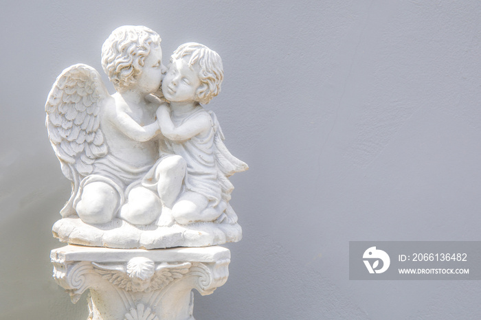 Baby or child angel statue in white color decoration at home garden park.