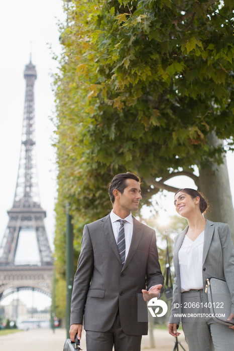 Business people talking, Eiffel Tower, Paris, France