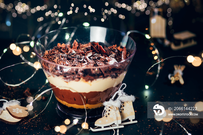 Pot of Irresistible Layered Billionaires Dessert made from mousse, Belgian chocolate sauce, and choc