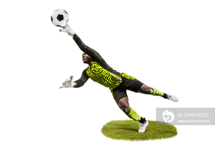 Male soccer player goalkeeper catching ball in jump. Silhouette of fit man with ball isolated on whi