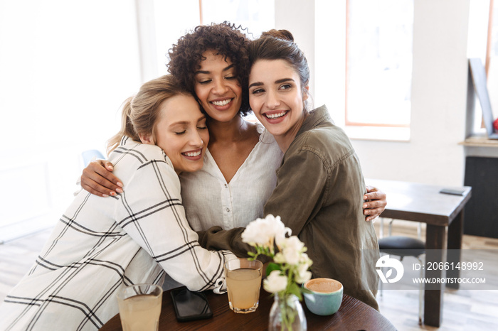 Happy young women friends having coffee break