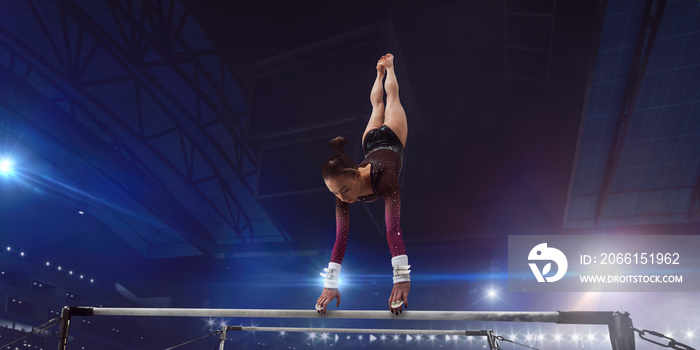 Female gymnast on professional arena.