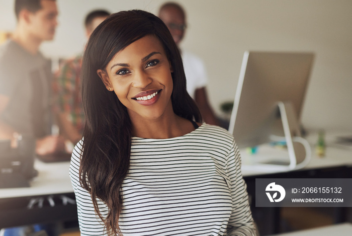 Portrait of smiling young woman in office