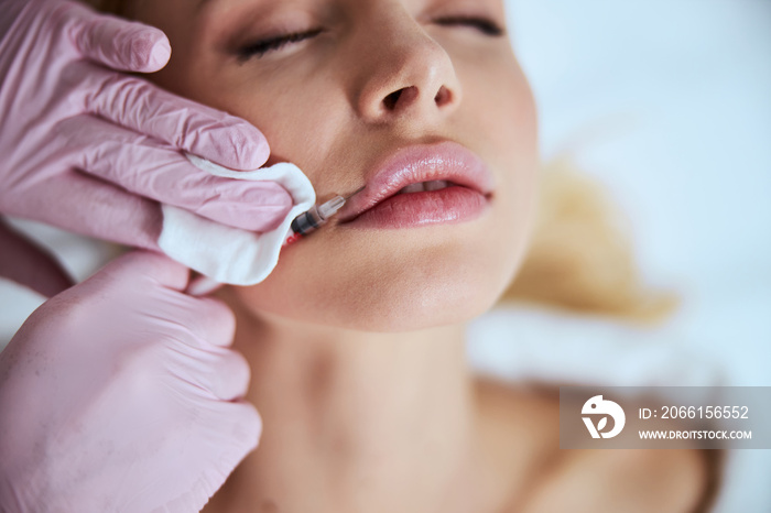 Female patient undergoing the lip enhancement procedure