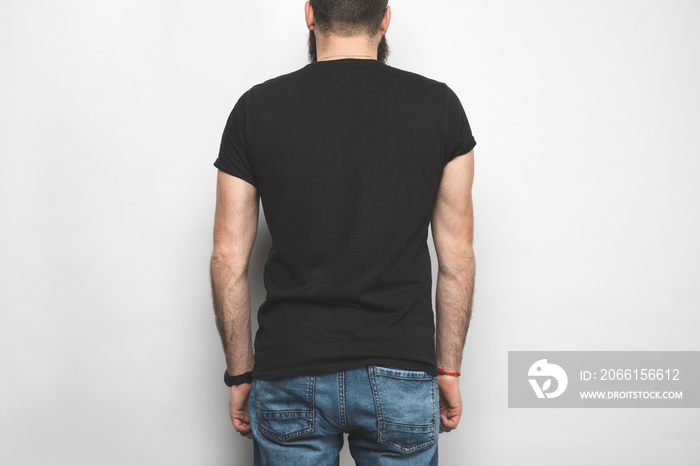 back view of man in black t-shirt isolated on white