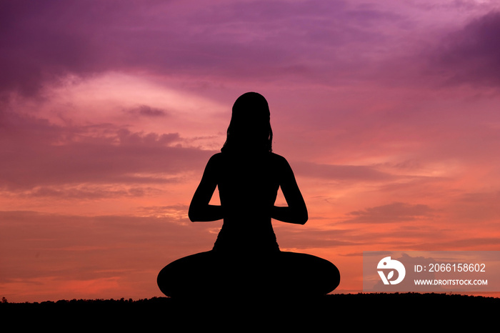 Silhouette of a beautiful Yoga woman