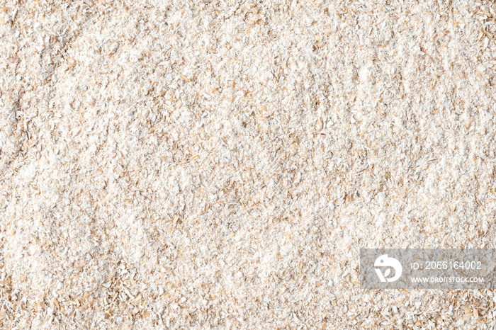 Whole grain flour texture. Background with copyspace. Close up. Top view