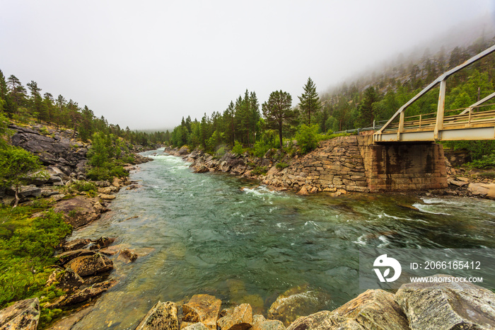 Bridge over mountain river in Norway