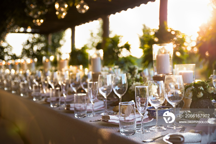 Outdoor wedding celebration at a restaurant. Festive table setting, catering. Wedding in rustic styl