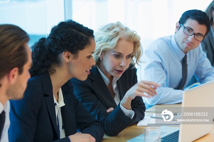 Corporate business people using laptop in conference room meeting