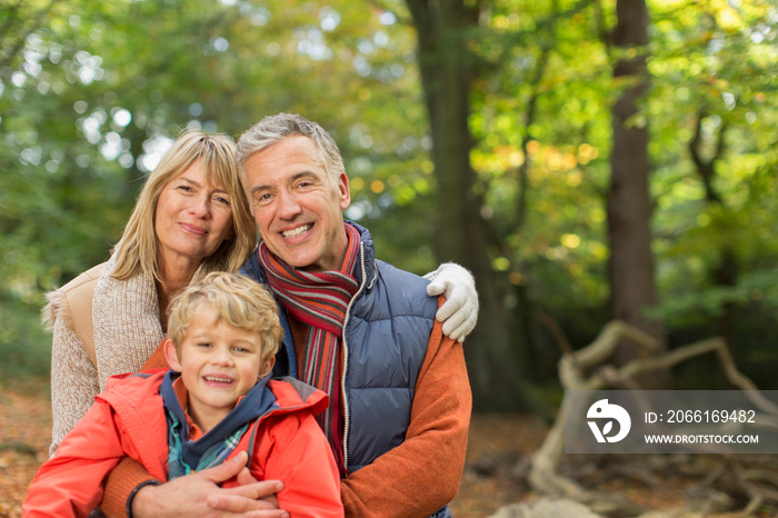 Portrait happy family in autumn woods