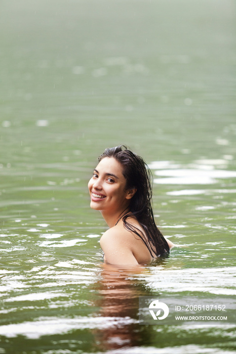 Woman swimming in river