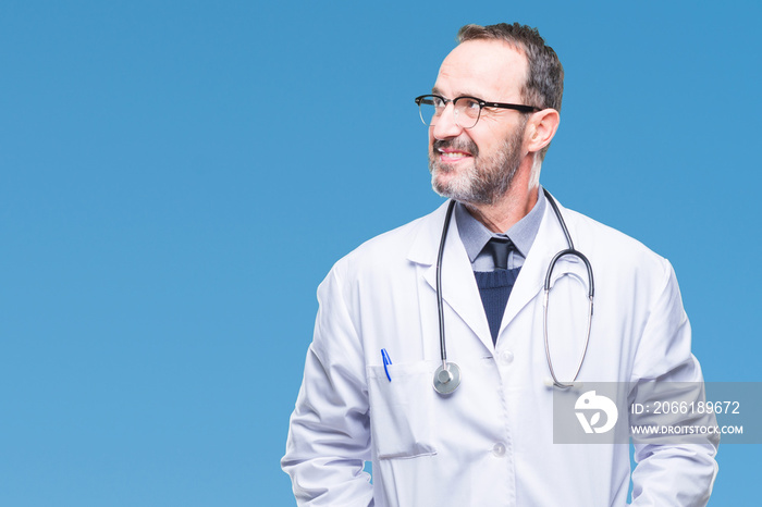 Middle age senior hoary doctor man wearing medical uniform isolated background looking away to side 