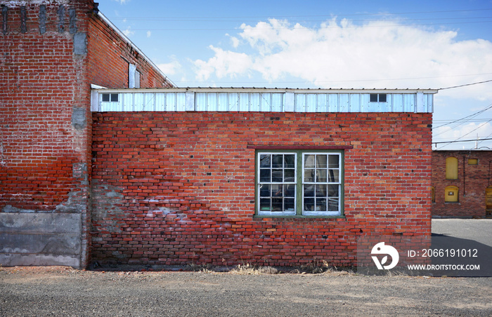 aged and worn photo of old brick building