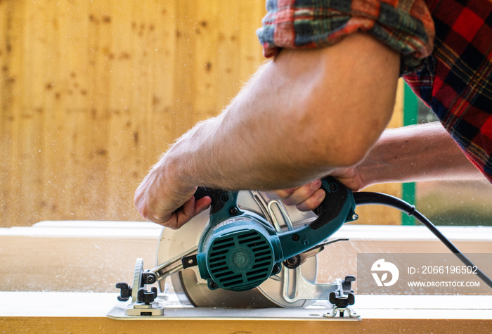 Carpenter using circular saw