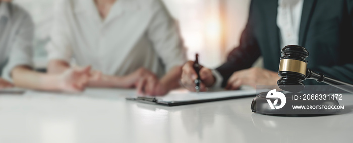 Business people and lawyers discussing sign contract document, sitting at the table. Concepts of law, advice, legal services.