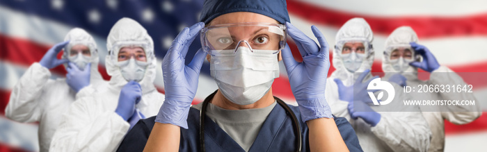 Doctors or Nurses Wearing Medical Personal Protective Equipment (PPE) Against The American Flag Banner