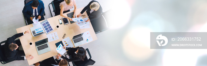 Business people group meeting shot from top widen view in office . Profession businesswomen, businessmen and office workers working in team conference with project planning document on meeting table .