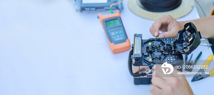 Banner equipment  testing the signal on the fiber optic cable copy space.