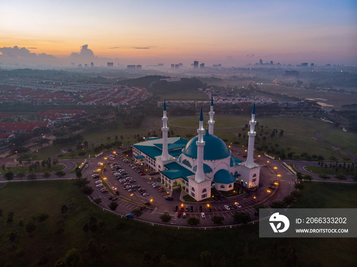 Aerial shot of sunrise over the beautiful mosque at Johor Bahru, Malaysia.