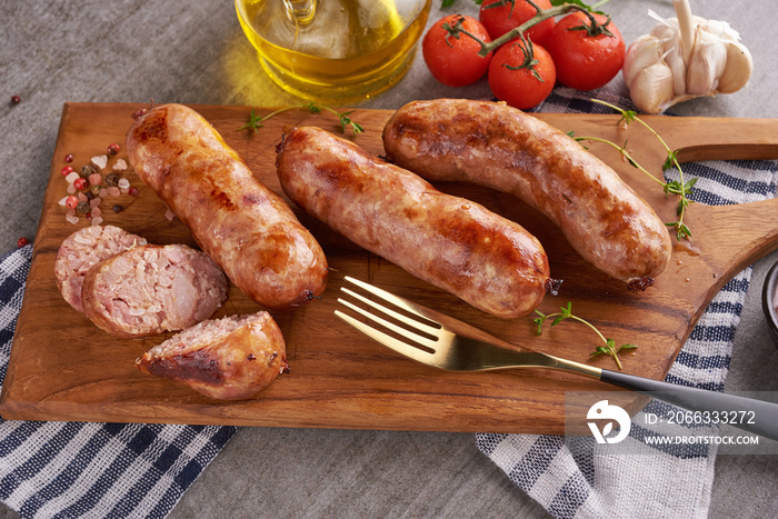 Homemade sour sausages with Thai herbs, vegetables. homemade pork meat sausages in skins with herbsand spices. Top view. Black background. Barbecue sausage with fresh parsley. grilled sausages.