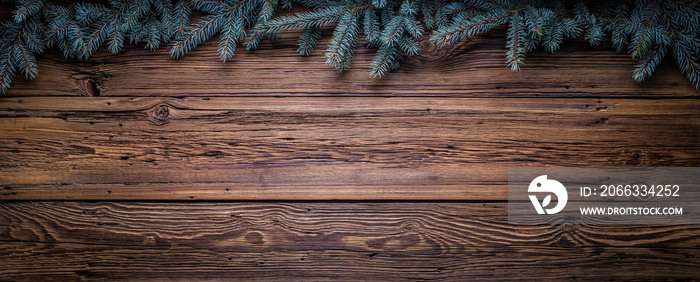 Cozy Christmas copy space background with spruce branches and barn wood