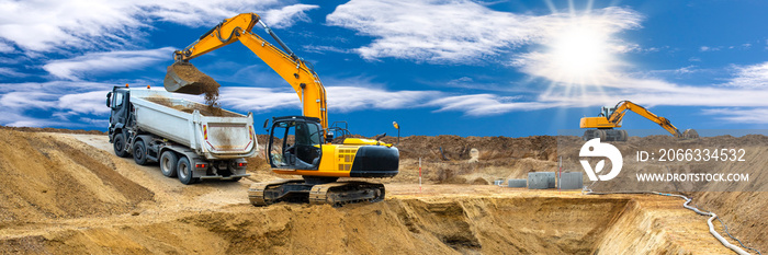 excavator ist working and digging at construction site