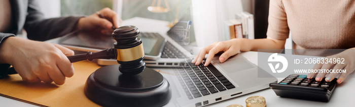 Business and lawyers discussing contract papers with brass scale on desk in office. Law, legal services, advice, justice and law concept picture with film grain effect