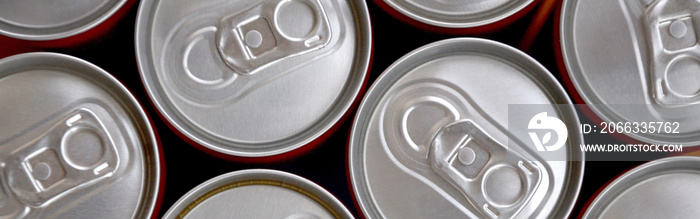 Many cans of soda soft drink or energy drink containers. A lot of recycled cans made from aluminum and being prepared for re-production.