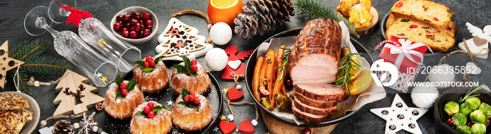 Christmas dinner table setting on dark background.