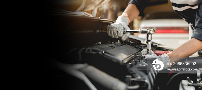 Automobile mechanic repairman hands repairing a car engine automotive workshop with a wrench, car service and maintenance,Repair service.