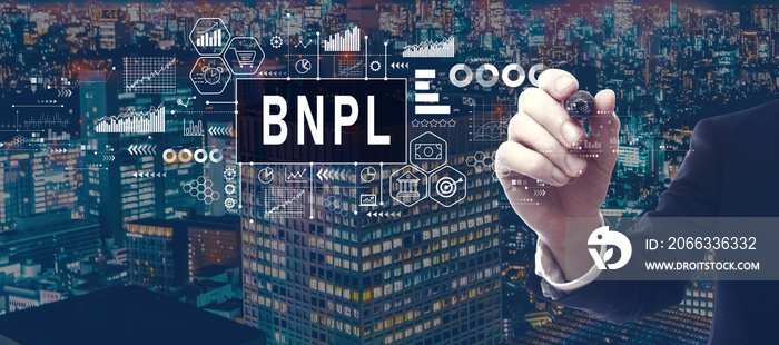 BNPL - Buy Now Pay Later theme with businessman in a city at night