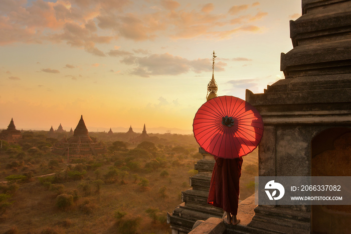 Monk relaxing in ancient temple on during sunset,Bagan Myanmar