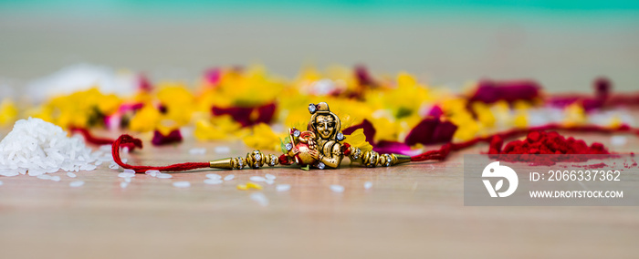 Raksha Bandhan is an Indian Festival. rakhdi with an elegant Rakhi, Rice Grains and Kumkum. A traditional Indian wrist band which is a symbol of love between Brothers and Sisters.