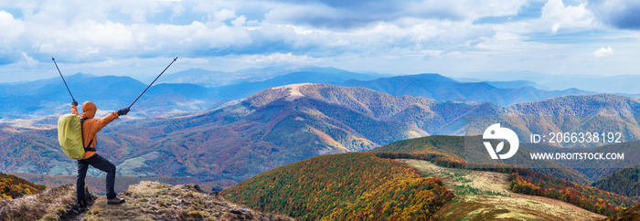 Hiker enjoying the trip in the top of mountain.