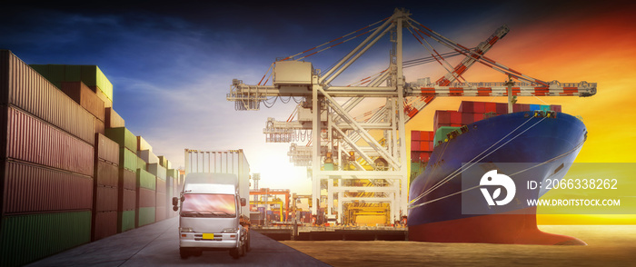 Cargo truck and cargo ship with container going at the cargo yard port  for backgound for  transportation freight shipping by ship concept.