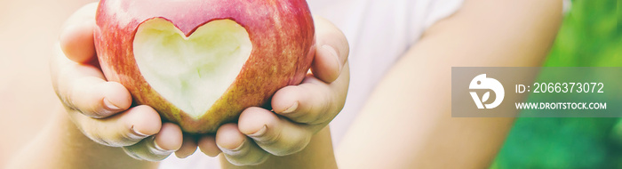 Child with Child with an apple. Selective focus.