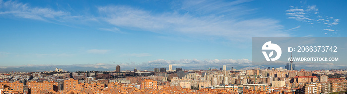 Skyline of the city of Madrid, on a day with blue sky and clouds, from the popular neighborhood of Vallecas