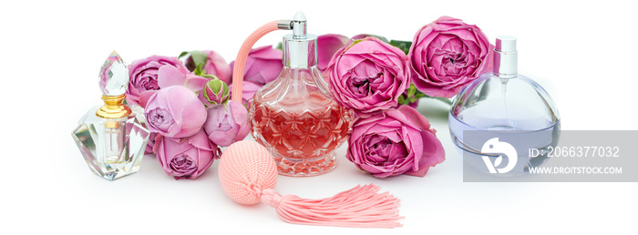 Perfume bottles with flowers on white background. Perfumery, cosmetics, fragrance collection