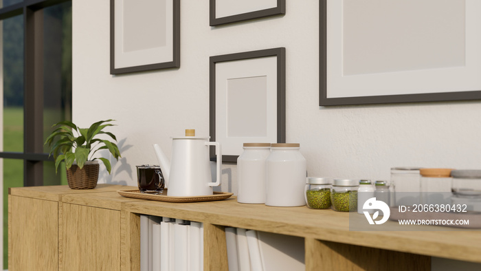 Minimal wood cabinet tabletop with coffee kettle, seasoning bottles and decor over the white wall