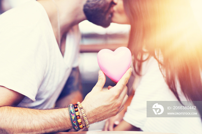 Romantic couple dating in cafe and holding presents