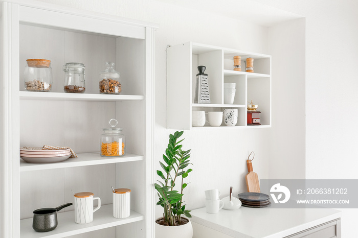 Interior of kitchen with modern shelves