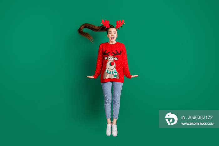 Full size photo of attractive funny cute lady jump high x-mas party good mood wear reindeer headwear