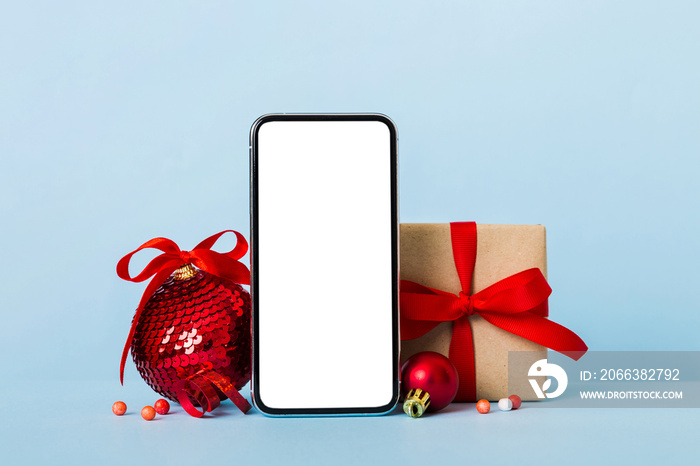 Digital phone mock up with rustic Christmas decorations for app presentation with empty space for yo