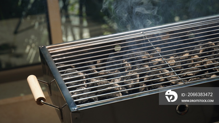 Glowing coals in a barbeque grill. Hot barbecue grill