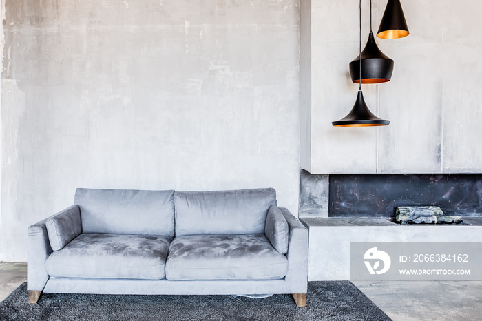 interior of living room with sofa and fireplace.  discreet stylish gray colors