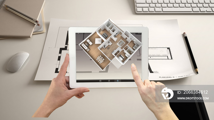 Augmented reality concept. Hand holding tablet with AR application used to simulate 3d pop-up intera