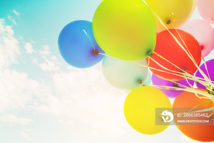 Colorful balloons done with a retro filter effect. Concept of happy birth day in summer and wedding,